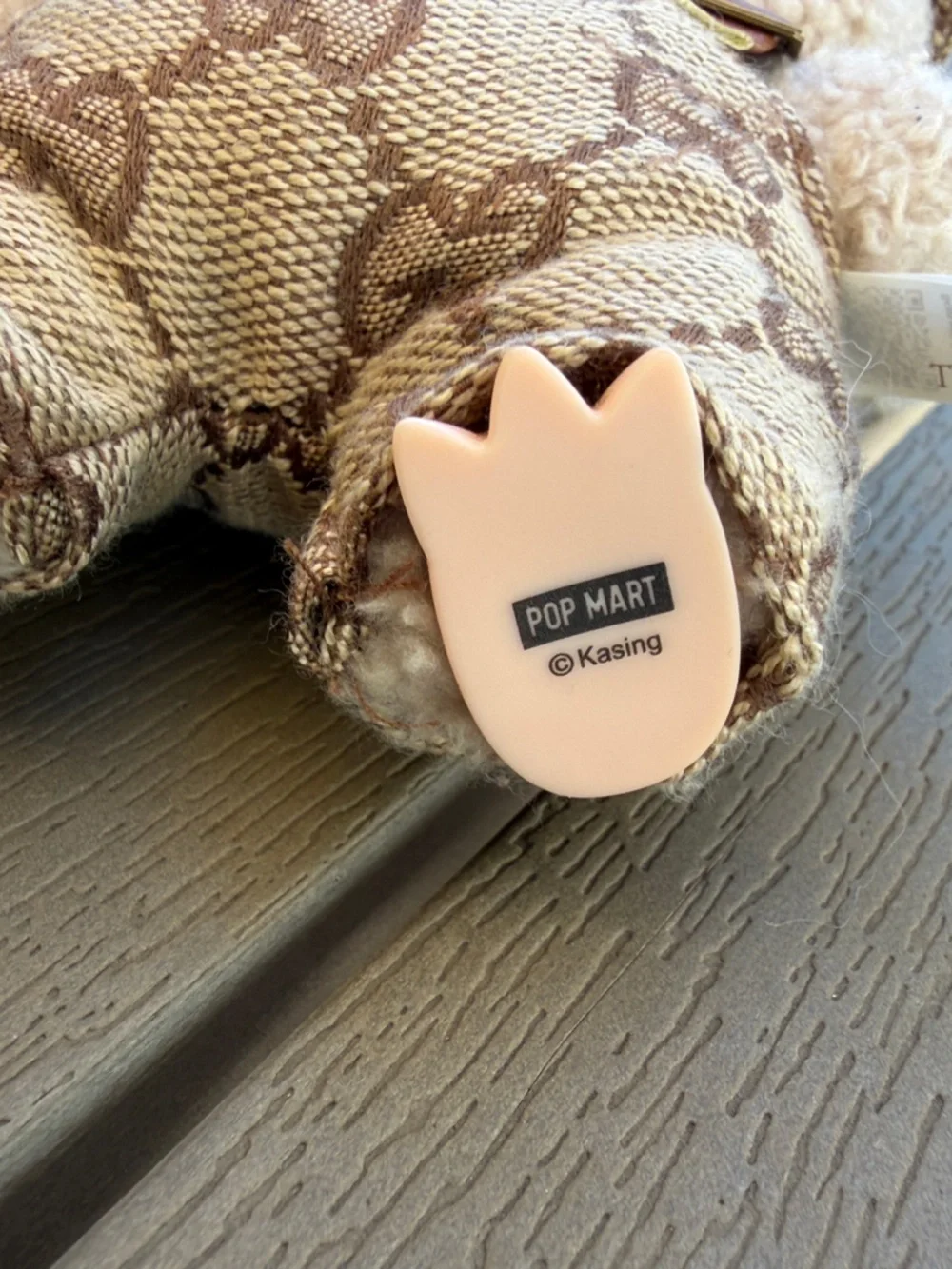 Exciting Macaroon Labubu in Toffee with designer overalls and bucket hat